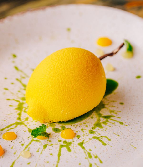 Close up of plate containing lemons and lemons