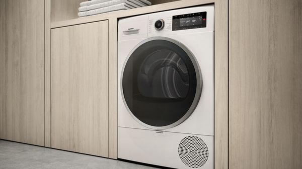Máquina de secar roupa por bomba de calor Gaggenau numa casa moderna