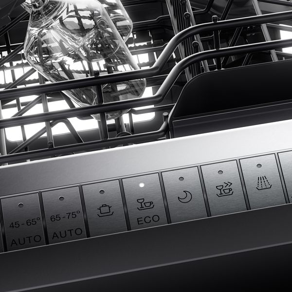 Close up of a Gaggenau dishwasher control panel with eco aware button active 