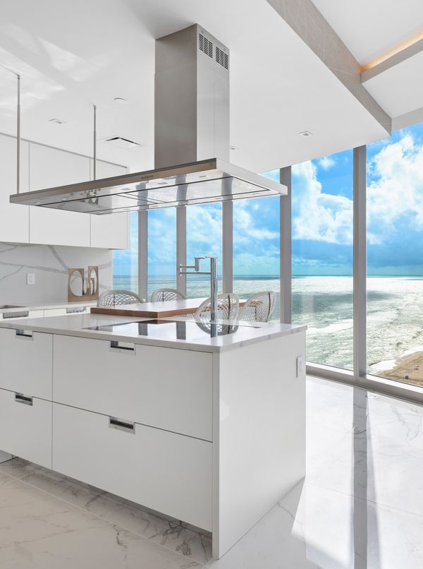 Image of a bright kitchen with a beach view in a Ritz Carlton Residence at Sunny Isles Beach 