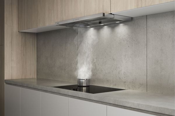 Gaggenau 200 series flex induction cooktop with built in downdraft ventilation in a modern kitchen