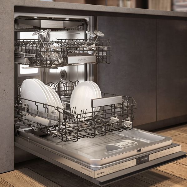Close-up of a Gaggenau 400 series dishwasher in a modern environment with its door open 