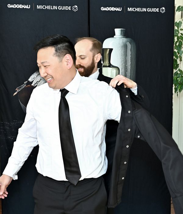 Chef Yuan Tang receiving his black jacket. 