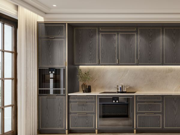 Interior kitchen image showing black wooden furniture and Gaggenau appliances.