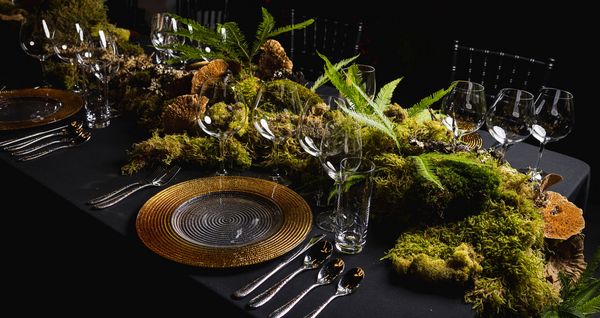 The ornate tablescape, featuring live ferns and moss. 