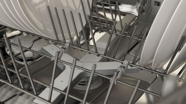Close-up of a Gaggenau 400 Series dishwasher spray arm and cutlery rack