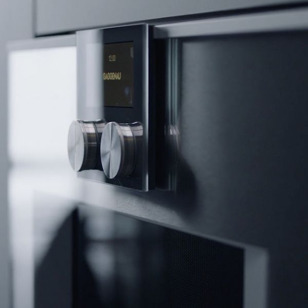 Close-up view of the Gaggenau combo-microwave control knobs and TFT screen