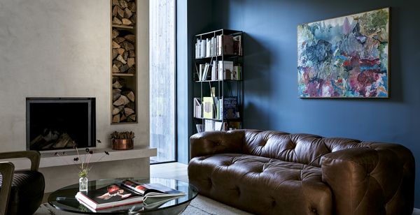 In the living room, a cozy fireplace beckons guests to sit down and get comfortable.