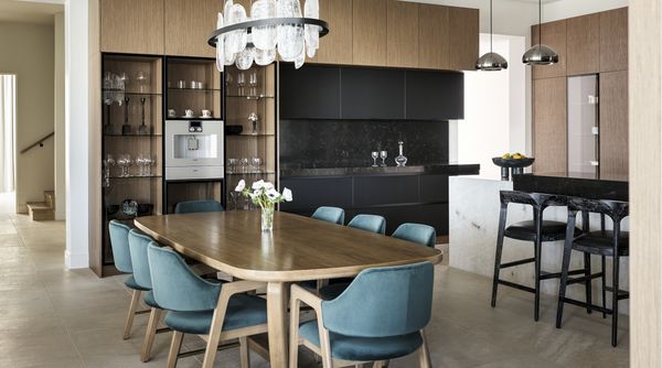 The dining area just off of the kitchen space, where the Gaggenau coffee machine is displayed front and center.