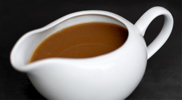 White jug full of turkey gravy