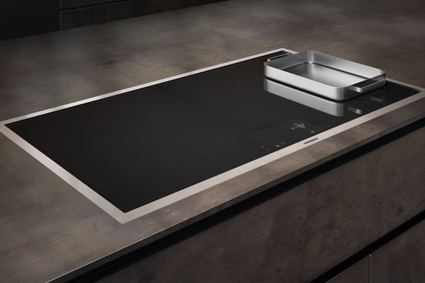 Gaggenau 400 series full-surface induction cooktop in a modern kitchen