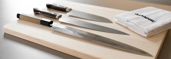 Tohru Nakamura's knives on a chopping board 