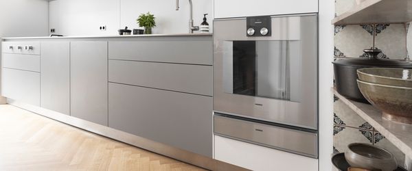 Gray kitchen cupboards and integrated oven 