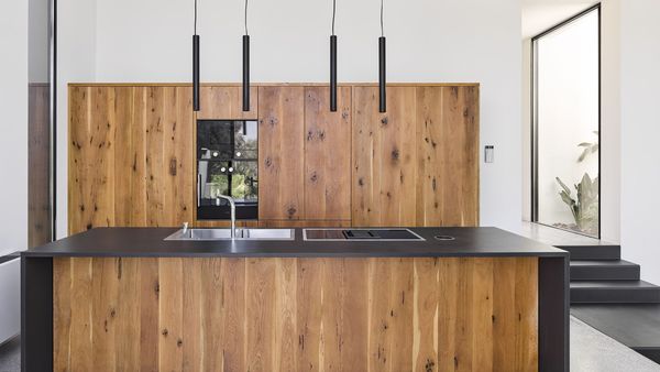 Wooden kitchen with modern Gaggenau appliances 