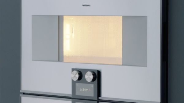 Gaggenau 400 series combo-steam oven with interior lit up 