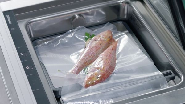 Close-up of two fish in a Gaggenau vacuum drawer  