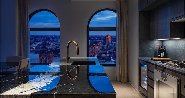 Blue hour overlooking Manhattan in the kitchen of a luxury apartment 