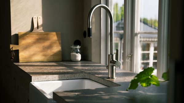 Rustic country kitchen sink and modern tap 