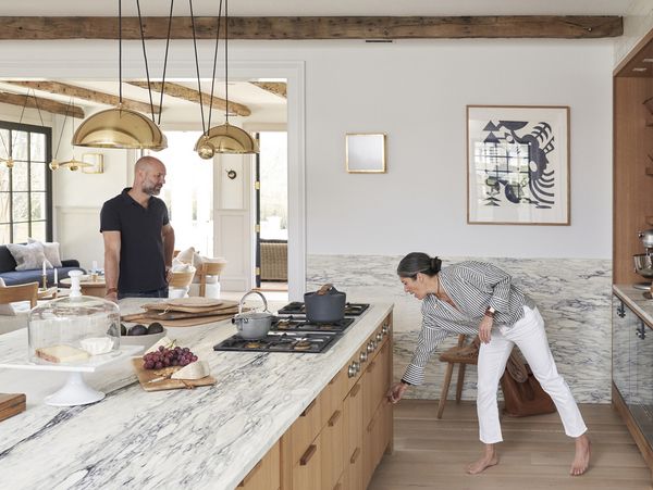 Pilar Guzman and Chris Mitchell in their kitchen with Gaggenau appliances 