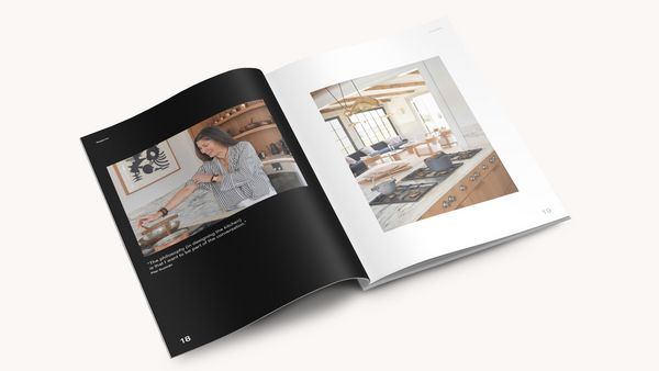 The Art of the Kitchen book laying open, showing a spread about Patina Modern. 