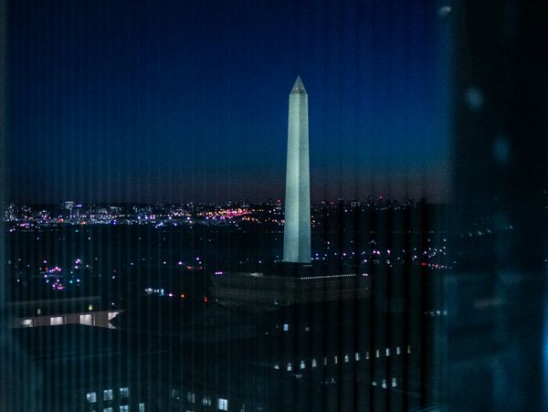 The view of the Washington Monument at night from The Old Post Office clock tower. 