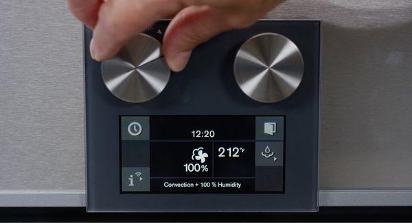 Image of a hand turning the knob on a Gaggenau Combi-steam oven