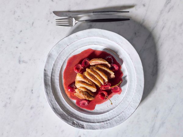 Duck breasts with cherry and orange sauce on a plate