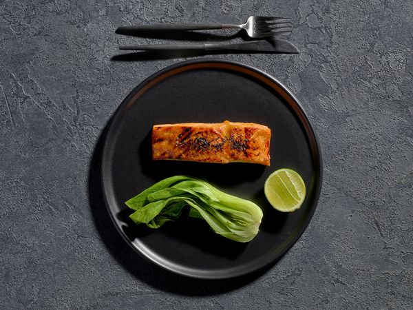 Miso salmon with bok choy on a serving plate