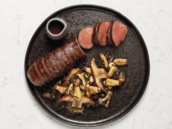 Sous-vide beef with sauté of forest mushrooms on a plate