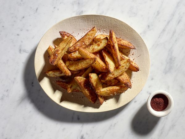 Spicy potato wedges with sumac and Aleppo pepper on a plate