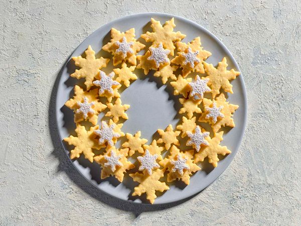 Traditional shortbread in the shape of snowflakes, arranged on a plate