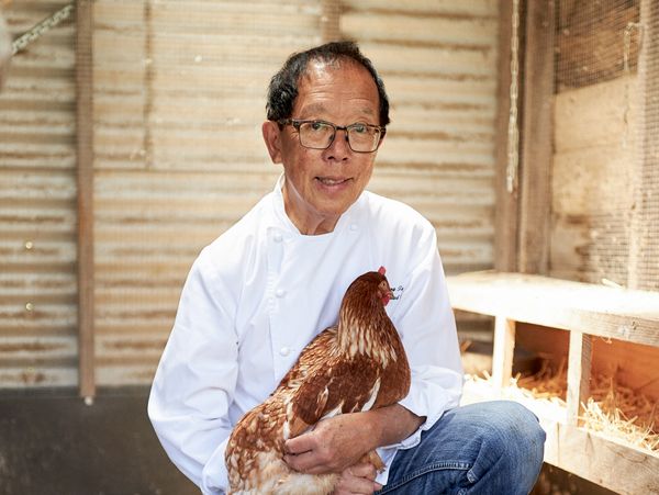 Portrait of chef Tony Tan holding a chicken
