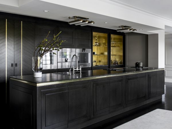 Gaggenau appliances installed in a dark luxury kitchen with island worktop