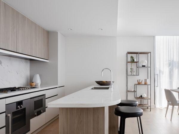 Gaggenau appliances installed in a bright luxury kitchen with island worktop