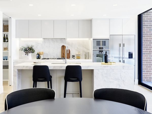 Gaggenau appliances installed in a bright luxury kitchen with island worktop