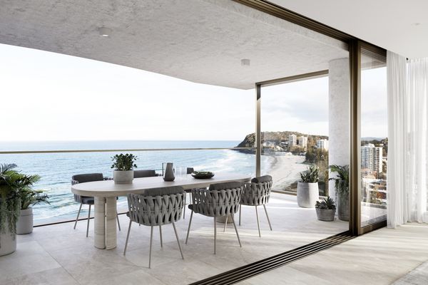 Internal view of a bright luxury apartment with sweeping views of beaches and the surrounding area