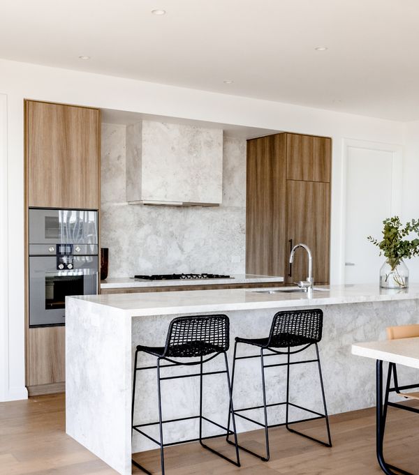 Gaggenau appliances installed in a bright luxury kitchen area with an island worktop