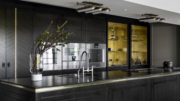 Gaggenau appliances installed in a dark luxury kitchen
