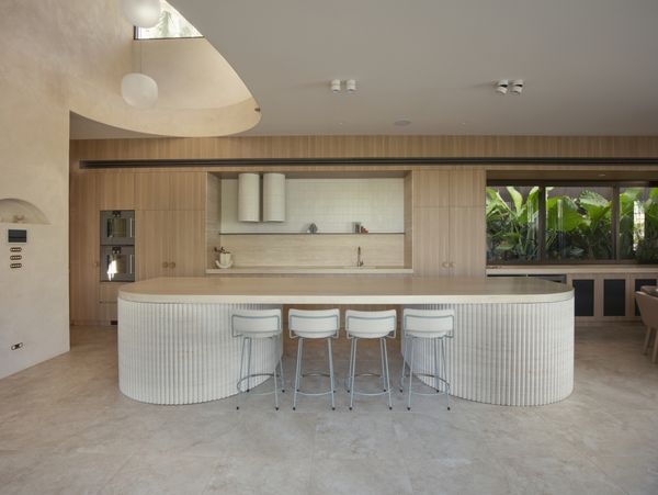 Gaggenau appliances installed in a bright luxury luxury kitchen with an island worktop