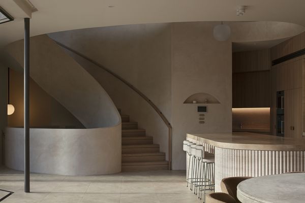 Internal view of a curved staircase and arched ceilings of luxury mediterranean style property fitted with Gaggenau appliances