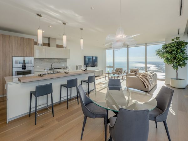 A view of a kitchen and living space in The Residences at The St. Regis Chicago.