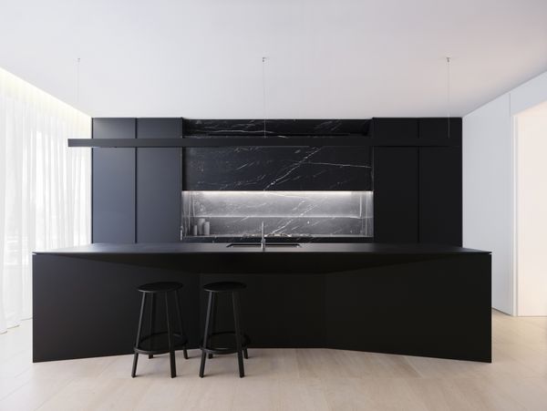 Gaggenau appliances installed in a luxury dark kitchen with island worktop