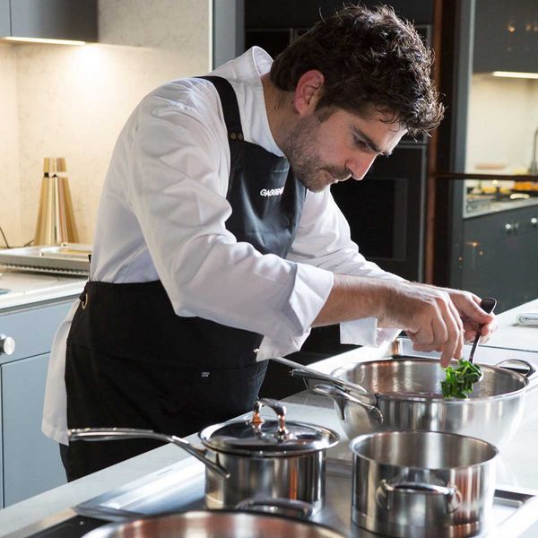 Close-up of chef Romuald Oudeyer preparing food in a Gaggenau kitchen 