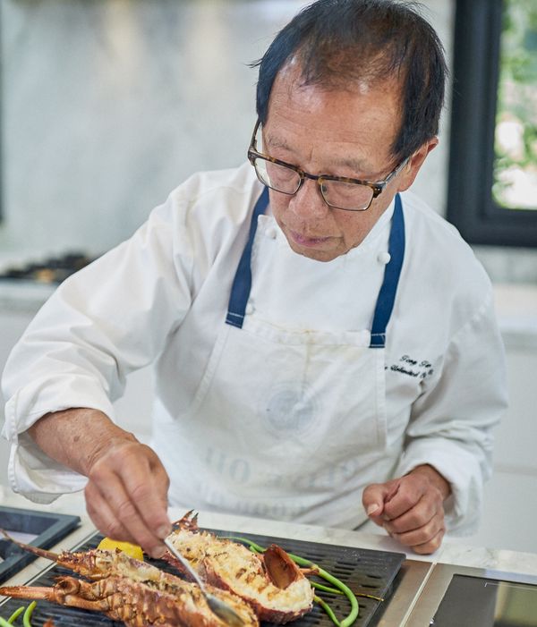 Portrait of chef Tony Tan cooking lobster