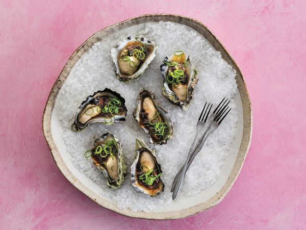 Steamed oysters with black bean sauce in a rustic bowl