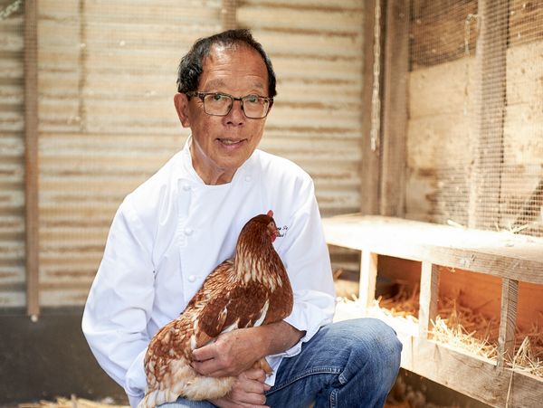 Portrait of chef Tony Tan with a chicken