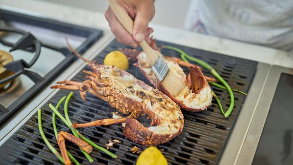 Close-up of chef Tony Tan grilling lobster on a Gaggenau 400 series electric grill