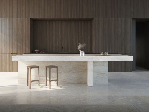 Ausschnitt eines modernen Wohn-Koch-Essbereichs mit hochwertigen Gaggenau Geräten und schlichten Möbeln aus Naturmaterialien.