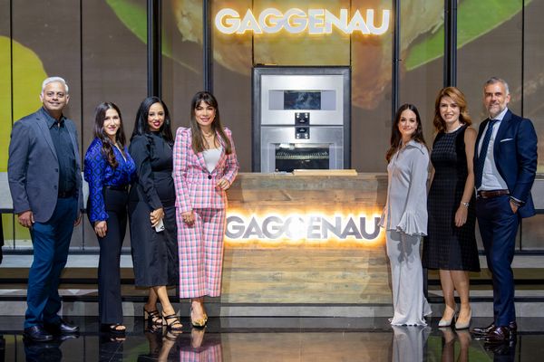 Group shot of Gaggenau representatives on stage during the Gaggenau Limitless Imagination evening at the Theatre of Digital Arts in Dubai 