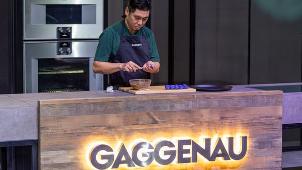 Chef Pang creating an omni-spinach dumpling on stage during the Gaggenau Limitless Imagination evening at the Theatre of Digital Arts in Dubai 